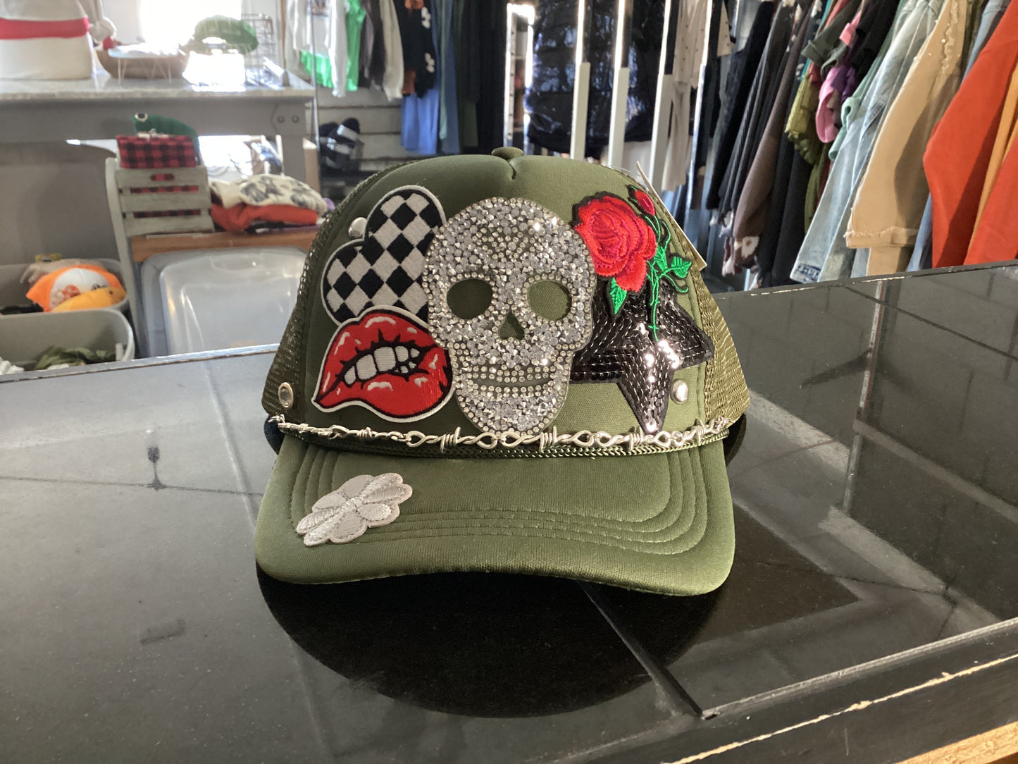 Hunter green Skelly trucker hat