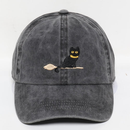 Black cat on a broom hat